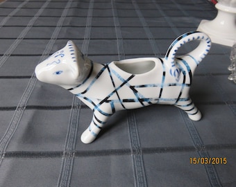 A cow on the table! A Creamer or gravy boat decorated porcelain.