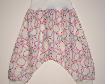 Sarouel bébé ronde fleurs rose fluo