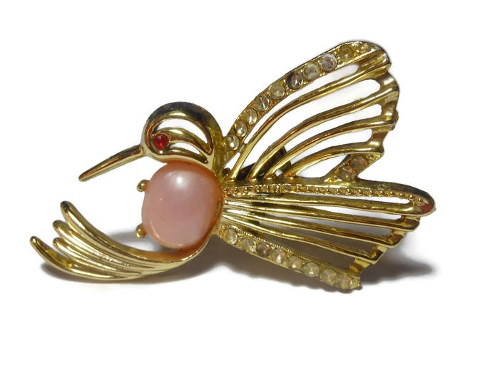 Jelly belly hummingbird brooch, gold hummingbird with pink lucite belly, red rhinestone eye and clear rhinestone embellishments, bird pin