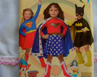 Batgirl Super Girl Wonder Woman Costumes Child Sizes 3 4 5 6 7 8 Simplicity 1035 uncut factory folded costume sewing pattern