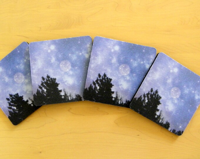 BLUE MOON COASTERS: A 4-piece set of absorbent foam-backed material featuring a night sky and a full moon