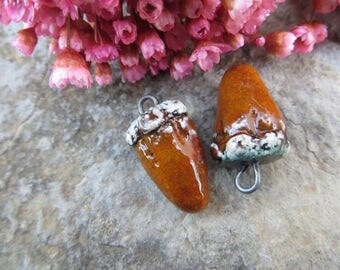2 antique charms beads... ethnic ceramic Moo creator. antique... molten lava. Unique and handmade