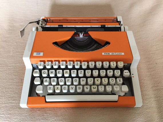 Vintage portable typewriter UNIS tbm de Luxe Olympia