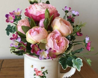 Pink Silk flowers in a Mug