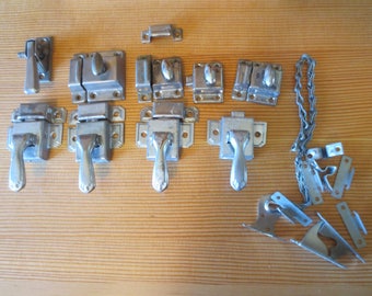 LOT of Vintage used Metal cabinet latches. 9 latches / 7 keepers / odds and ends / Original patina with a spotted dark metal patina .