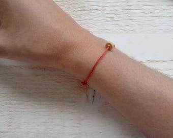 Pearl elder Bracelet on adjustable red cotton cord