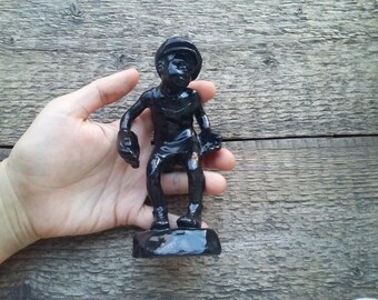 Figurine of metal boy goalkeeper
