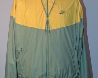 Nike light weight cagoule jacket UK Men's size large. Two tone Nike tracksuit top