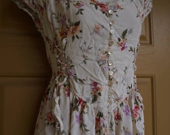 Vintage floral dress made by Rene Derhy with corset style laces on the sides labeled size L Large
