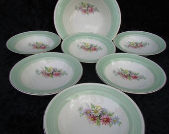 A lovely set of six vintage bowls and a serving dish.