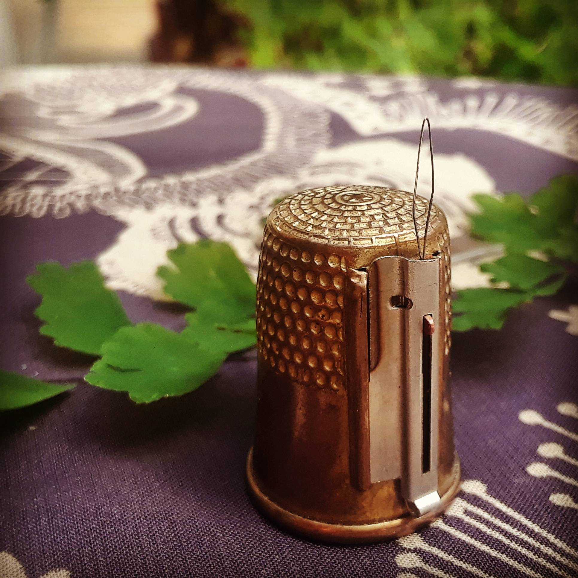 Thimble with Retractable Needle Threader and Thread Cutter