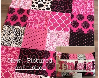 pink and black baby quilt and pillow set