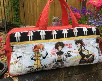 Creating beauty knitting bag with red and metallic gold printed stitch contrast and red & white spot lining