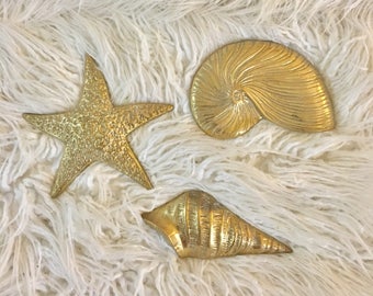 Vintage set of 3 solid brass coastal beach seashell wall hangings starfish conch and corithium