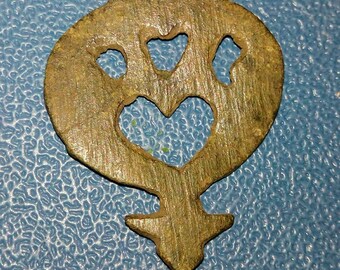 Old bronze ornamental suspension on a horse harness of the 19th century
