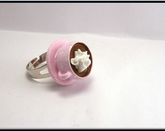 Ring Cup of hot chocolate with whipped cream.