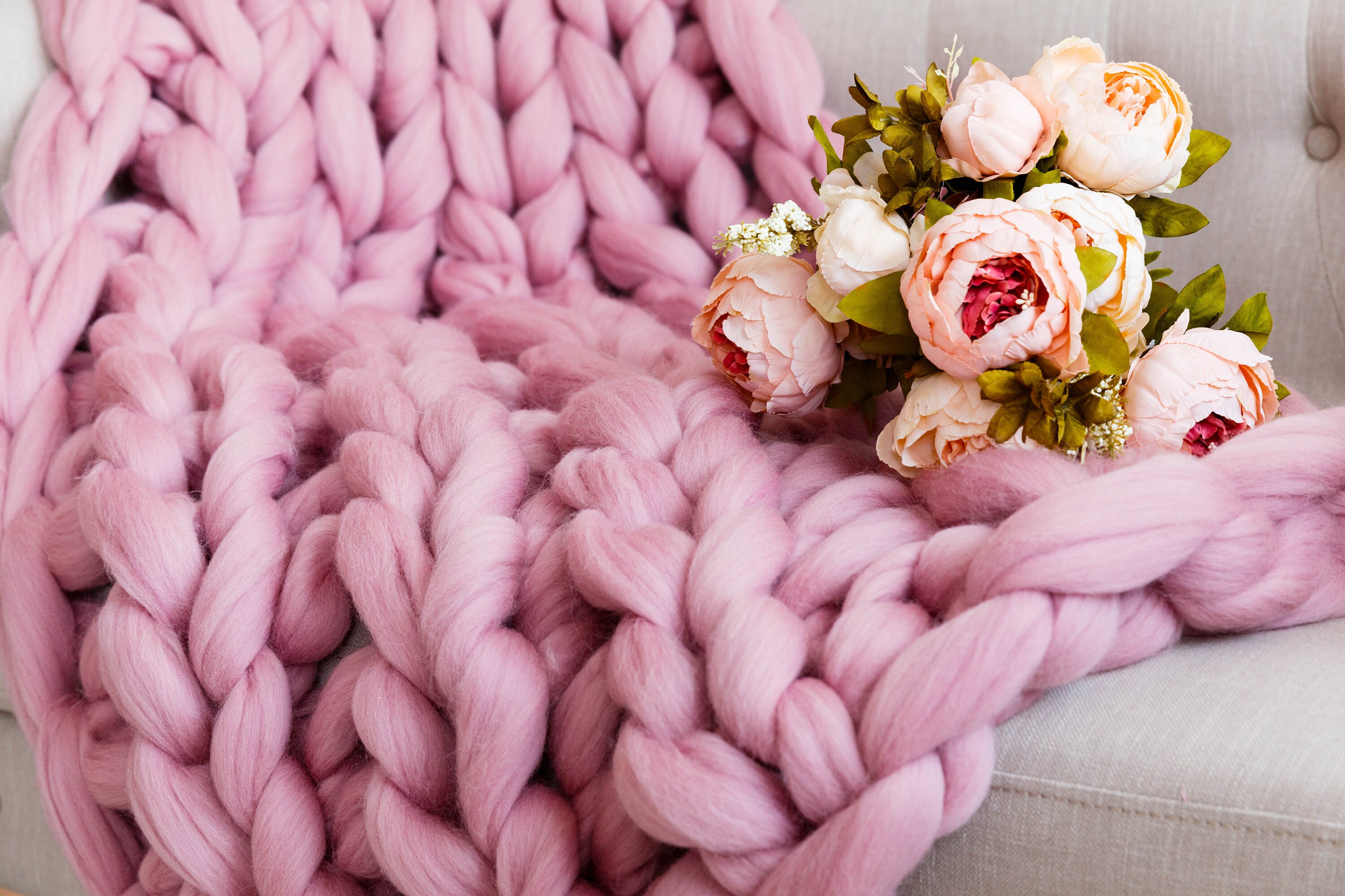 Chunky dusty pink wool knitted blanket Large cable sofas