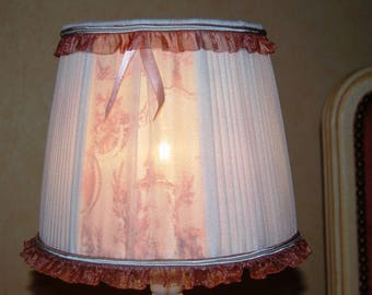 Lamp shade for lamp with pleated white chiffon.