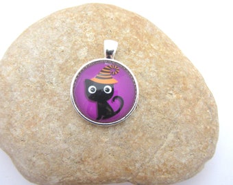 A pendant with black cat glass cabochon