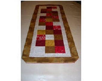 table runner in Christmas colors patchwork fabric