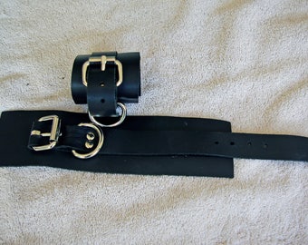 Pair of lighter weight black leather wrist cuffs.
