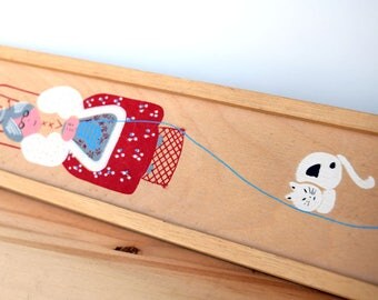 VIntage knitting needle case, wooden storage container with a picture of an old lady knitting with a cat and a window