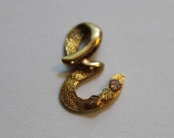 20% off 10 kt gold pendant initial "E" for necklace or charm, it has a lot of beautiful detail work on it, possibly black hills gold 3/4 in