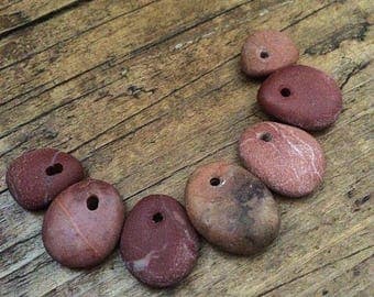 Drilled beach stones, beach stone beads, top drilled sea stone pendants.