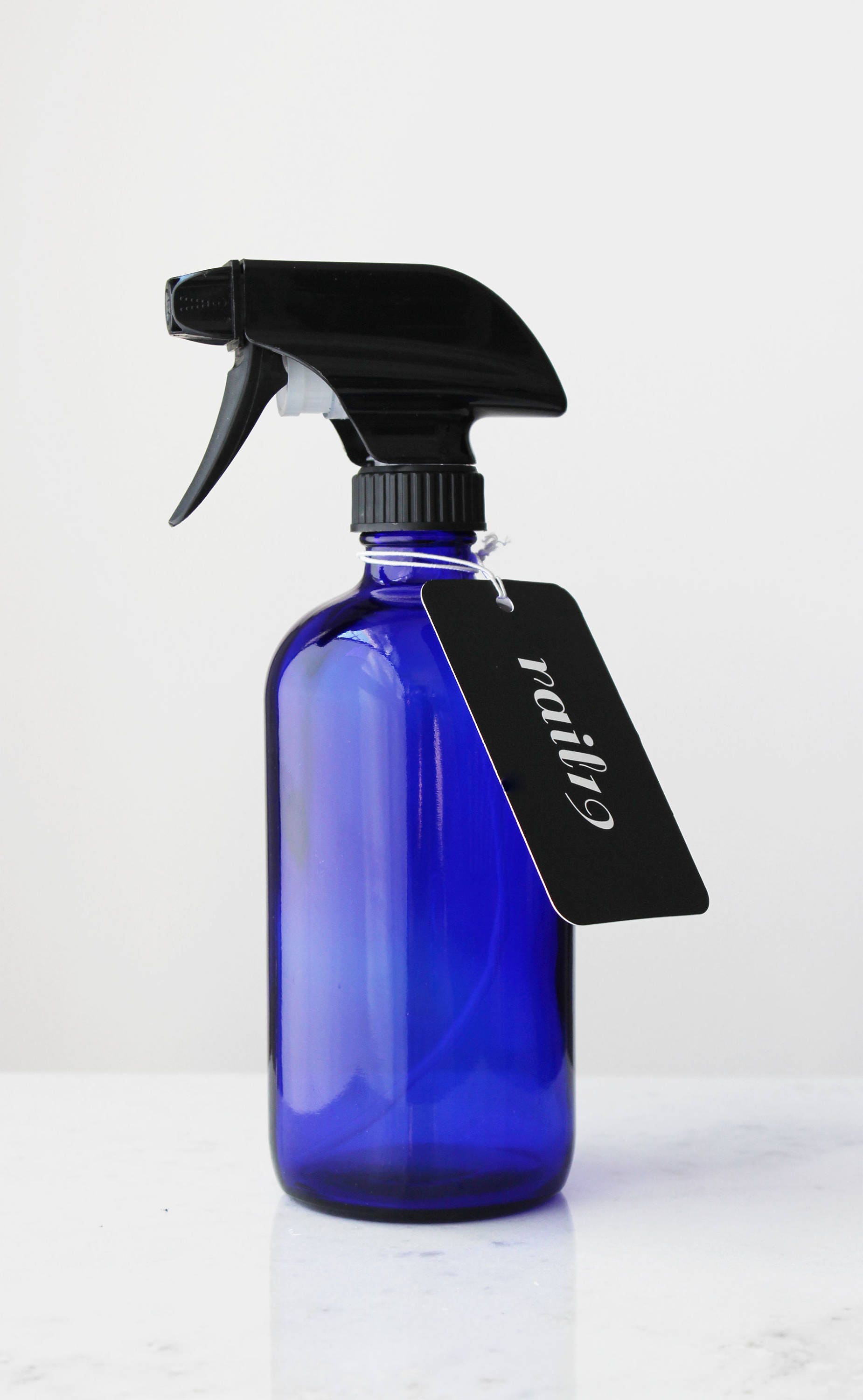 Blue Glass Spray Bottle with Black Spray Nozzle Trigger