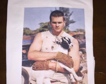 Tom Brady holding a Goat