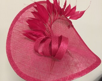 Stunning Fushia fascinator with feathers and bow, perfect for races, weddings or any special occassion