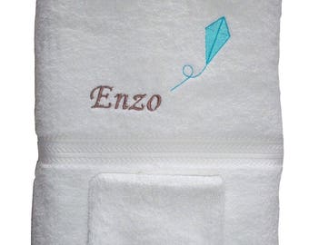 Towel embroidered with a name and a kite