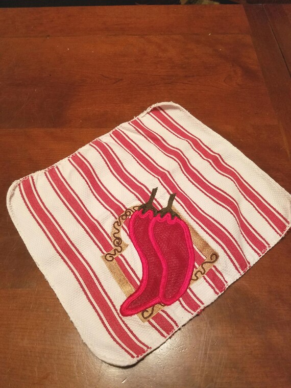 Dishrag with embroidered pepper design with built in scrubby