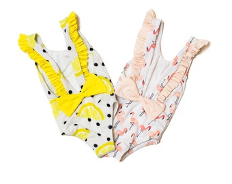 Babies one piece swimsuit for diaper, flamingo or lemon pattern print, regular neck line, deep v open back with a bow & ruffles alongside