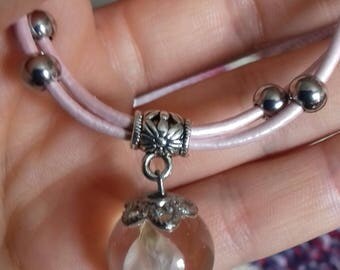 Pendant with natural flower inside transparent sphere