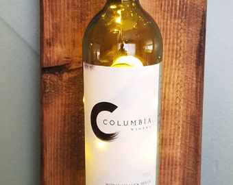 Illuminated wine bottle sconce
