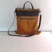 large leather handbag with compartments