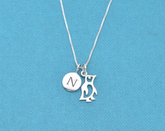 Little girl's penguin necklace in sterling silver on a 14" sterling silver chain and personalized with a sterling silver initial charm.