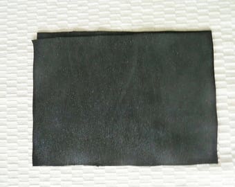 black leather size A4, waves effect, black satin, with reflections.