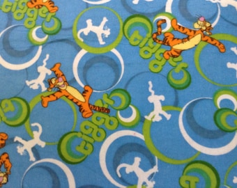 Flannel/Disney/Tigger on blue background cotton fabric by the yard