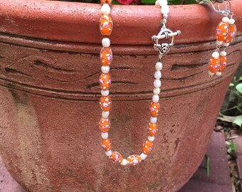 Orange glass beads with freshwater pearl necklace and earrings