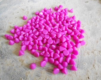 1 lot of 50 "studs" in fuchsia color acrylic beads