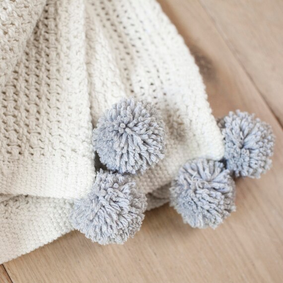 Knitted cotton baby blanket with pom poms unisex pram