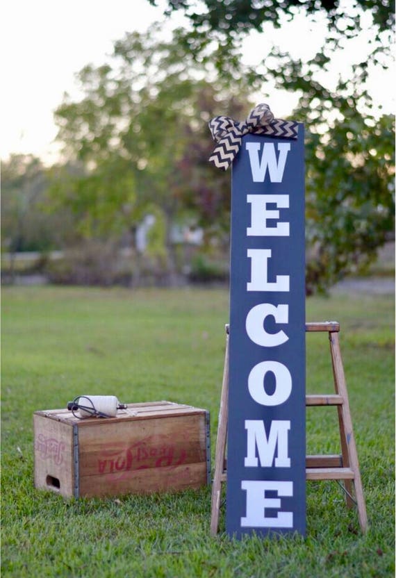Tall sign. Vertical sign. Black sign.