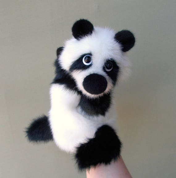 Panda. Big panda. Toy on hand. Puppet theatre. Bibabo. Toy