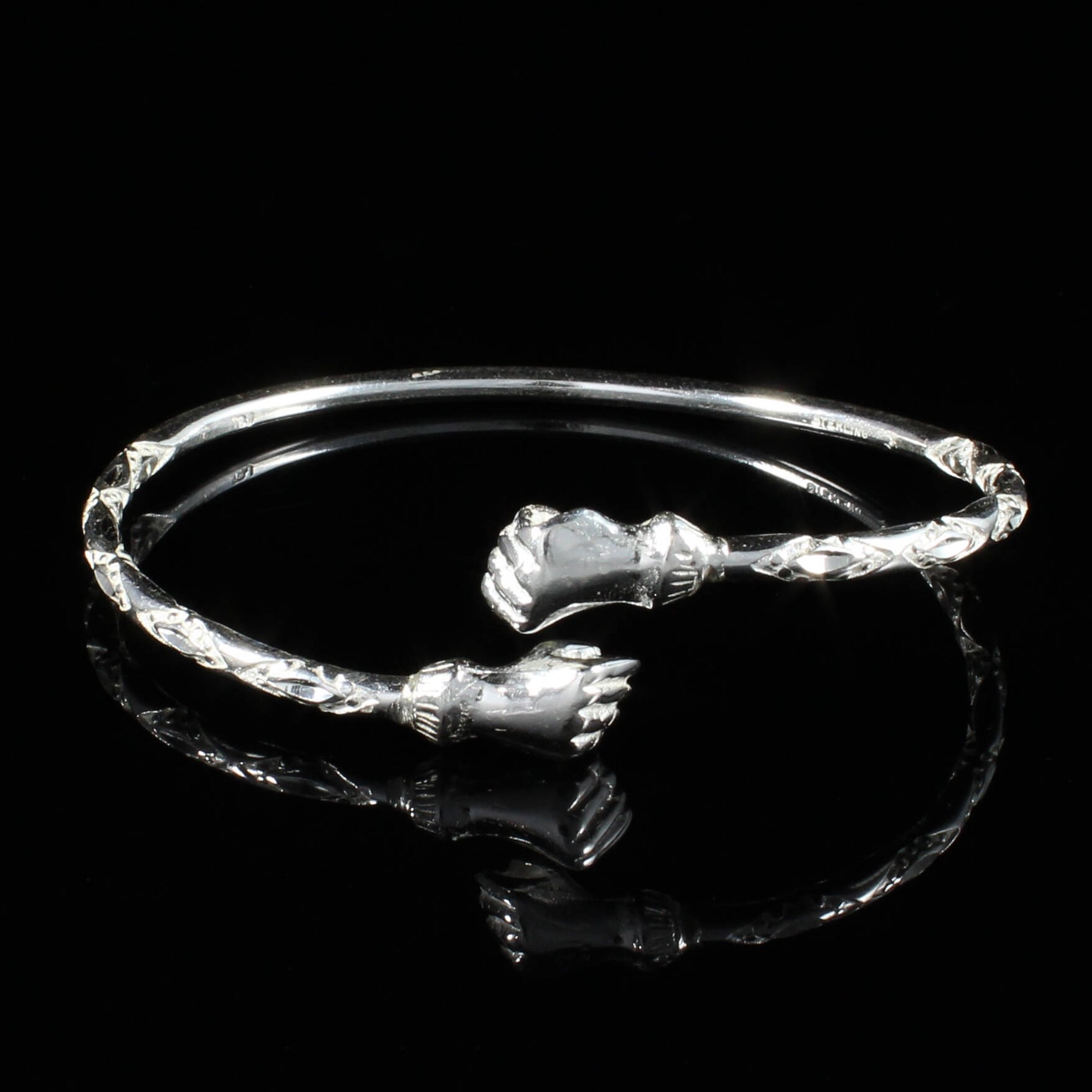 110 West Indian Bangle with Fists in Sterling Silver .925