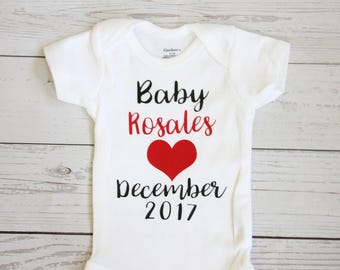 Pregnancy announcement onesie | Baby announcement onesie, Maternity photo shoot, last name, Custom baby shirt, Announcement onesie,