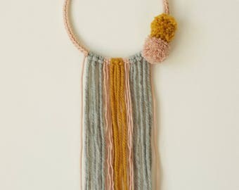 Dream catcher in wool with pastel colors tassels