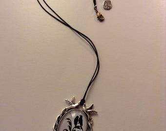 Black and white fantasy bird necklace