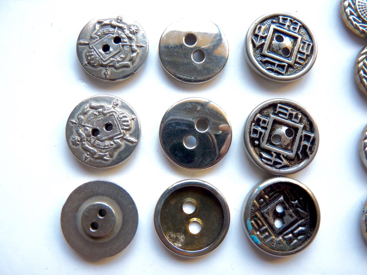 Different sets of buttons in gray metal, diameter of 1.8 cm, various ...
